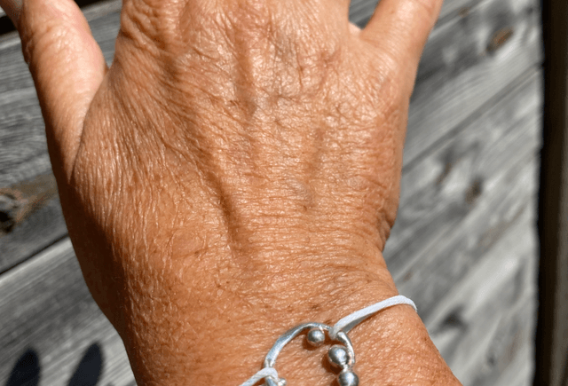 Bracelet Anémone gouttes sur cordon blanc