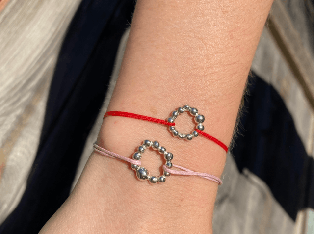 Bracelet cordon rose cercle gouttes 
