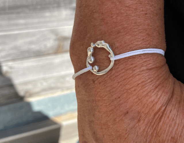Bracelet Anémone gouttes sur cordon blanc